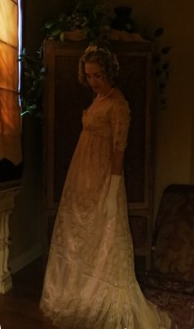 gown looking down candle light